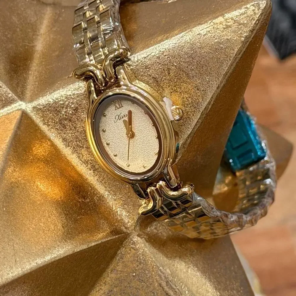 Gold watch with white face